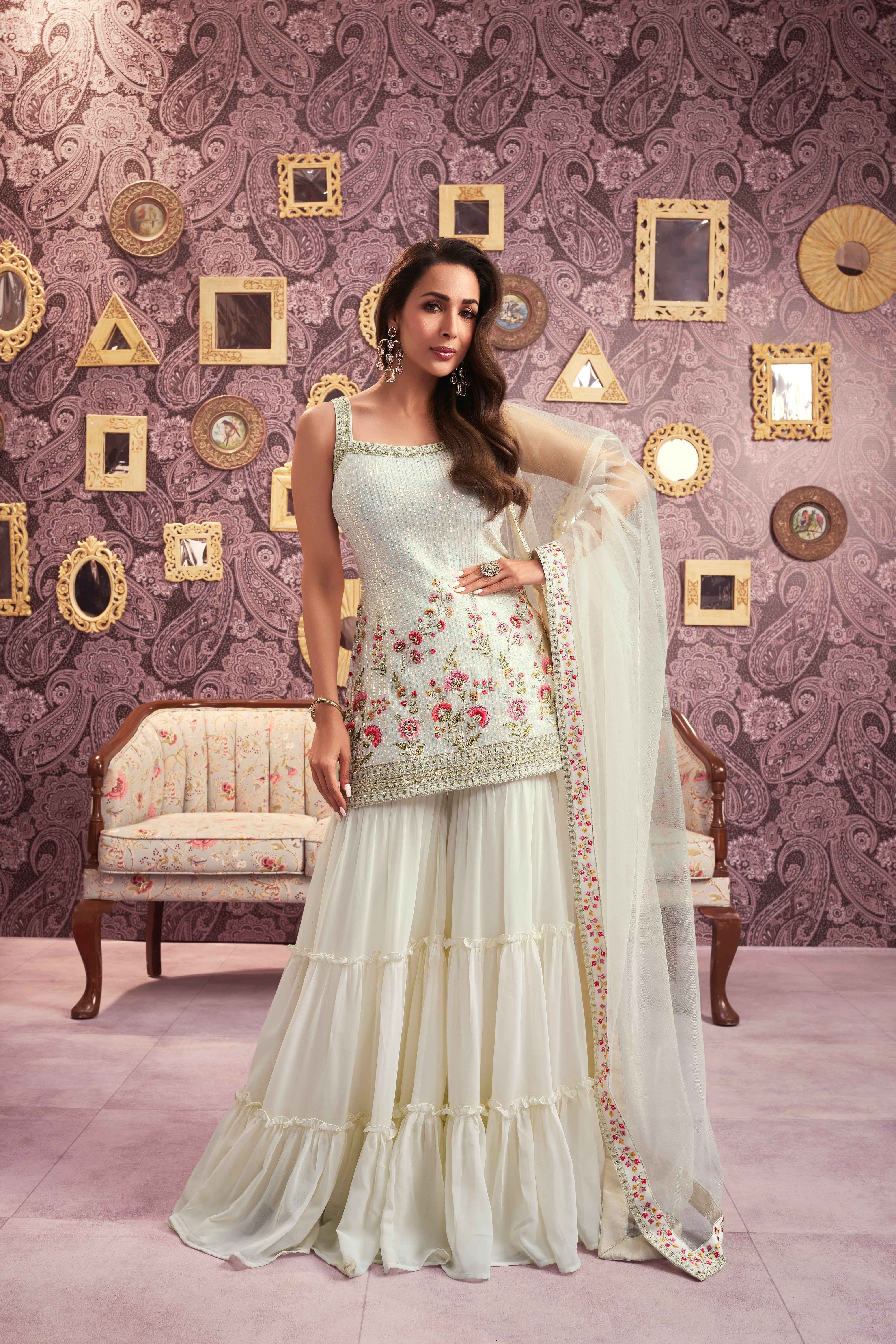 Women Floral Embroidered Regular Sequinned Kurti with Sharara & With Dupatta