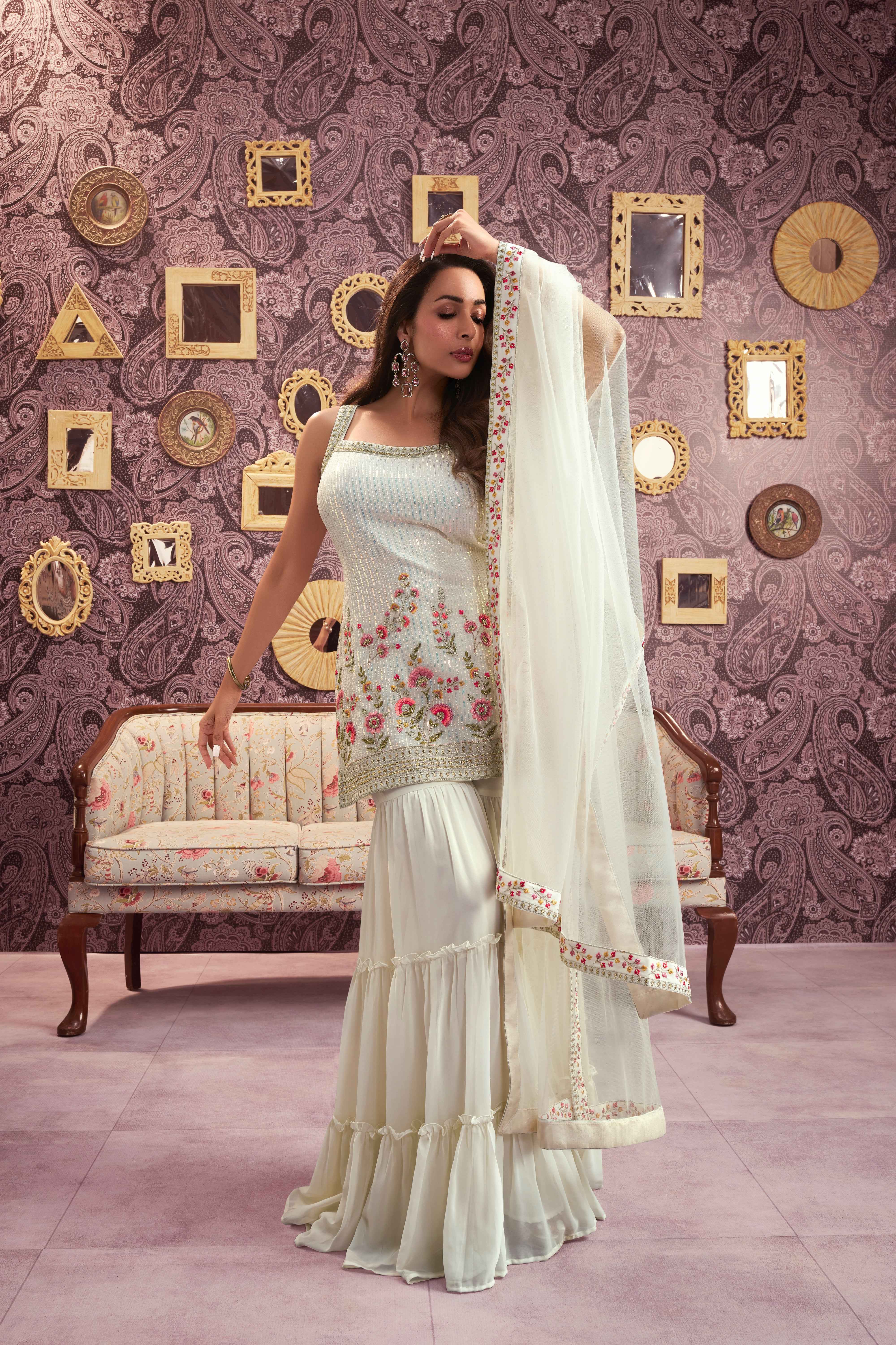 Women Floral Embroidered Regular Sequinned Kurti with Sharara & With Dupatta